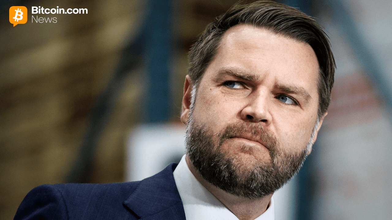 Close-up portrait photo of politician JD Vance looking thoughtful during a political media interview panel.
