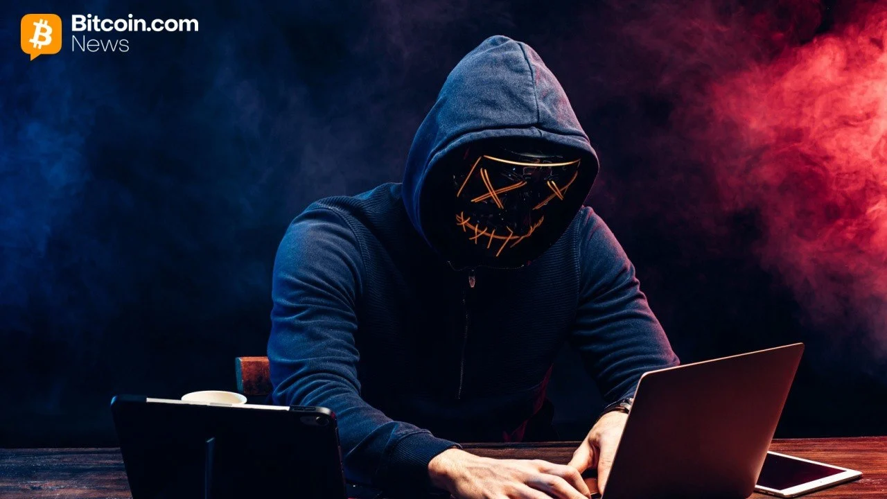 Moody low-angle shot of a hacker wearing an illuminated glowing neon cross mask and a dark hooded jacket.