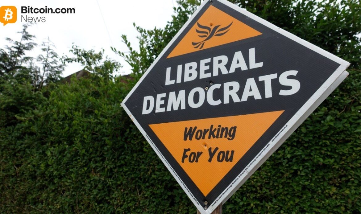 A diamond-shaped orange and black roadside sign displaying the text LIBERAL DEMOCRATS WORKING FOR YOU.