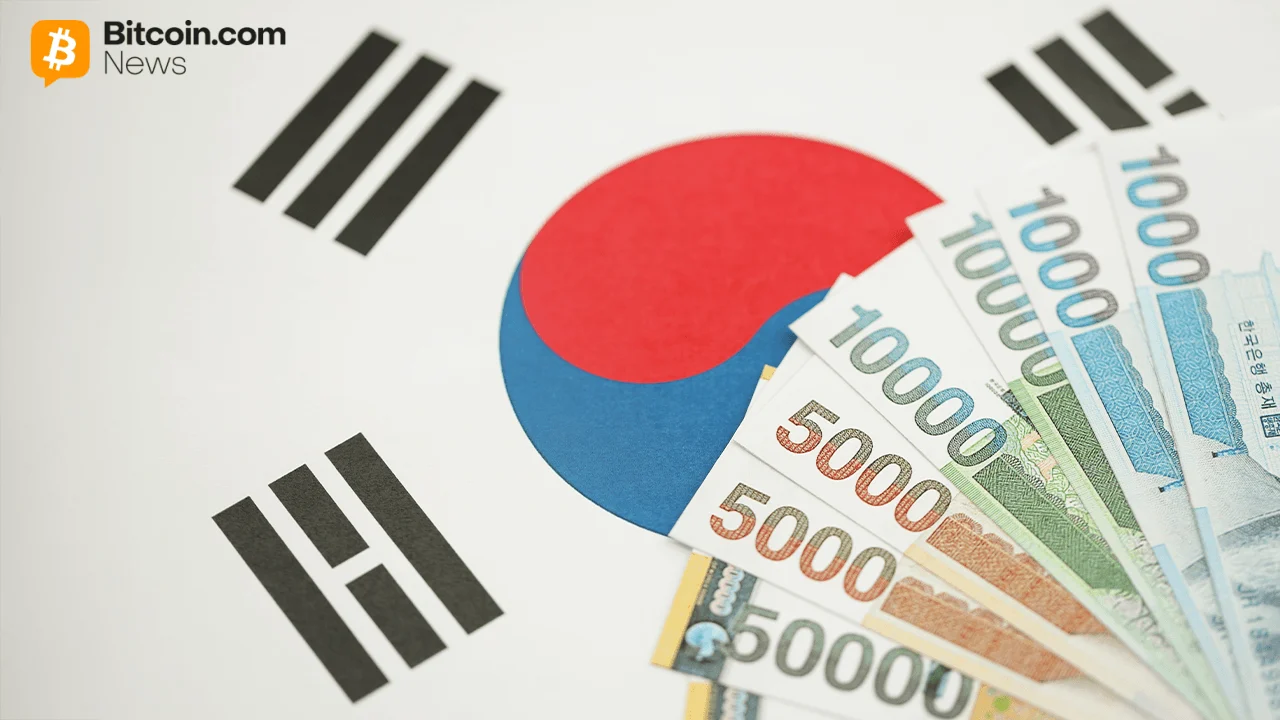 Close-up of a national South Korean flag graphic sitting next to a neat stack of crisp 10,000 Won fiat banknotes.