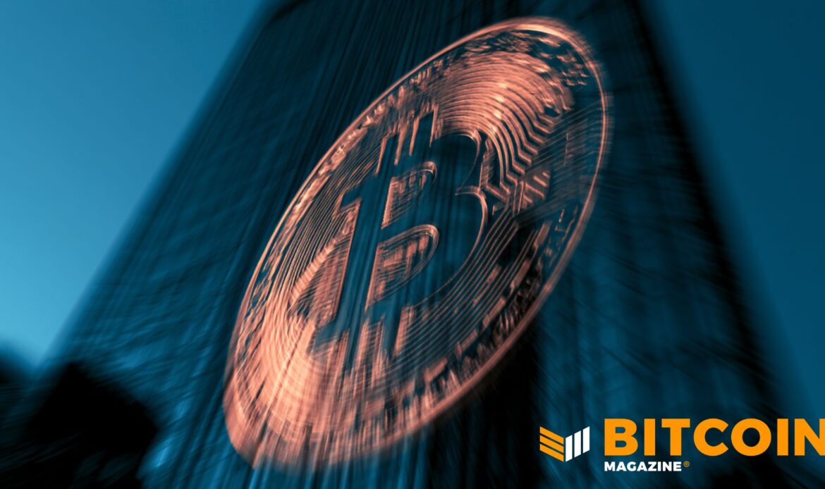 Macro view of a heavy, textured coppery Bitcoin coin angled dramatically against a dark backdrop.
