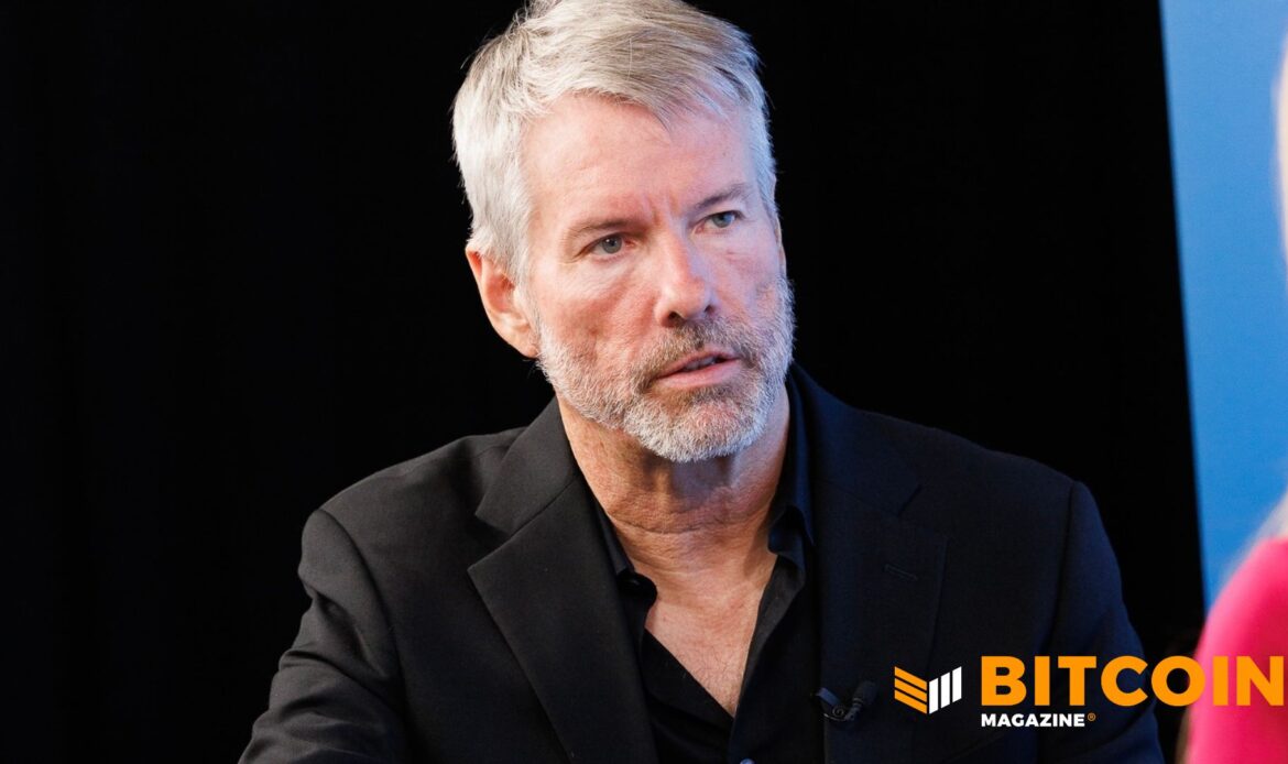 Profile headshot of MicroStrategy founder Michael Saylor speaking in front of a pitch-black background.