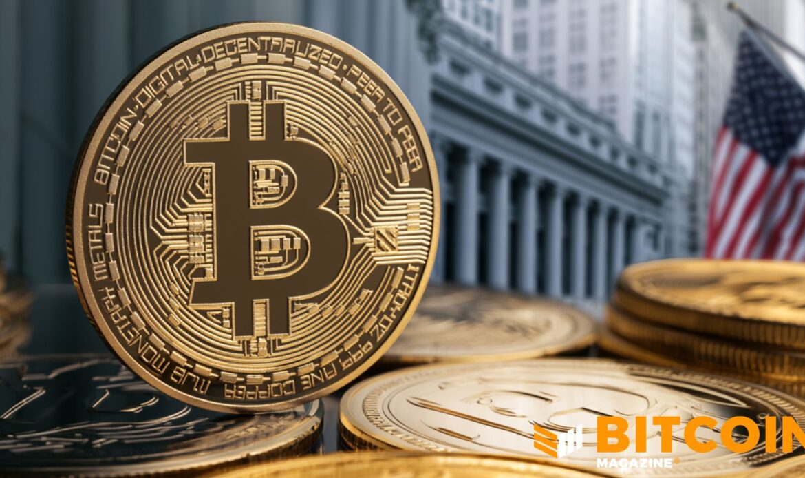 A heavy metallic golden Bitcoin coin positioned in front of a blurry, modern concrete corporate office facade.