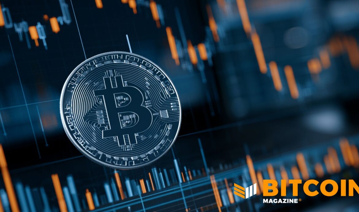A close-up Bitcoin coin overlaying downward-trending orange financial stock market chart bars.