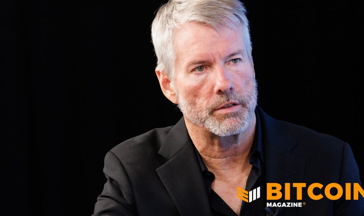 Headshot of MicroStrategy founder Michael Saylor speaking in front of a dark corporate backdrop.